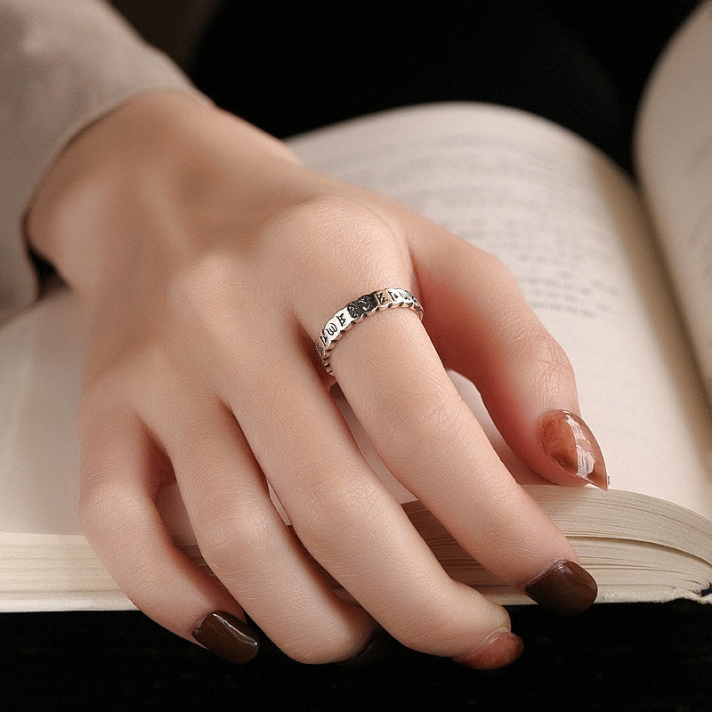 Six true words om mani padme hum ring top view, clear Sanskrit text engravings on polished 925 sterling silver surface