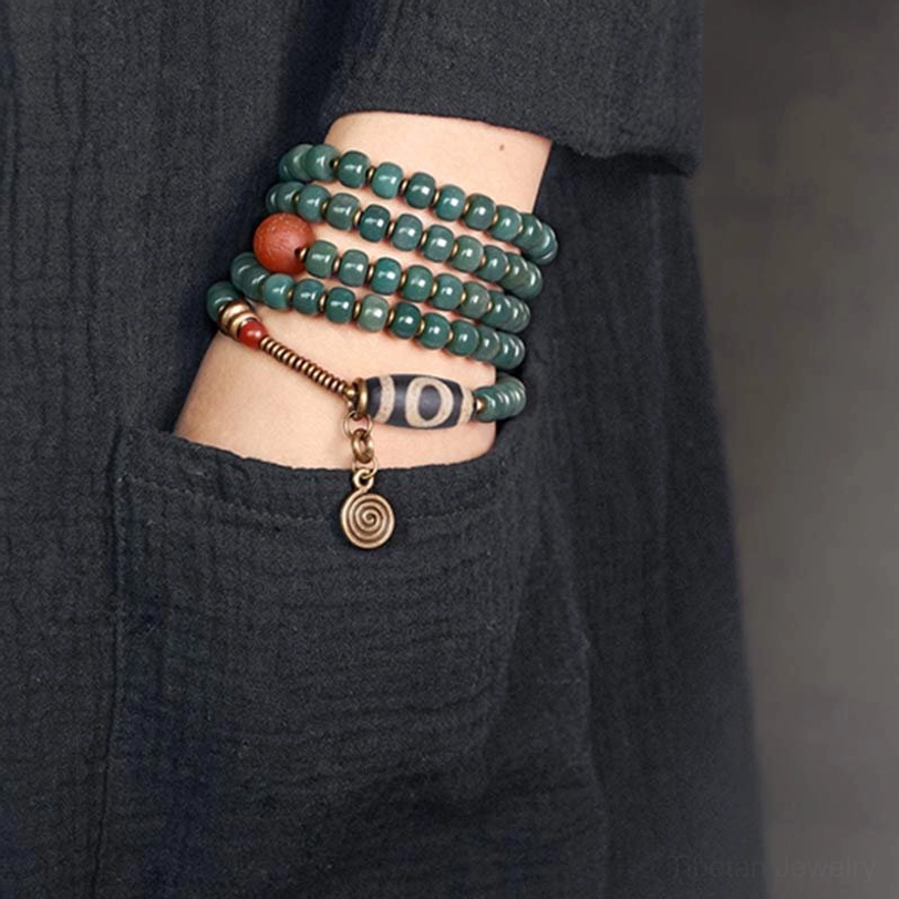 Multi-Wrap 108 Bodhi Mala Bracelet Worn on Wrist with Striped Dzi Bead