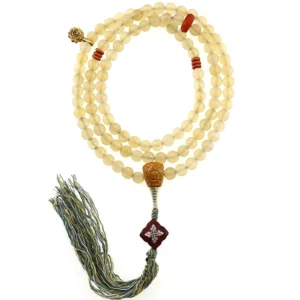Tibetan 108 prayer beads mala bracelet with green tassel pendant on white background, hanging display