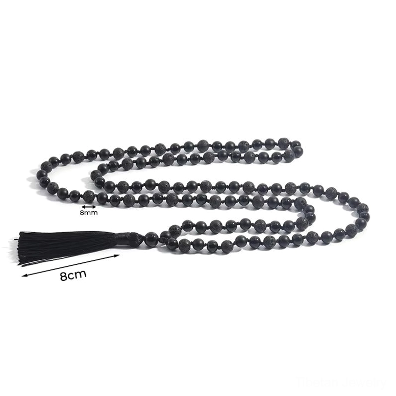 Top-down view of coiled 8mm black bead tibetan prayer necklace with marked bead size and long tassel
