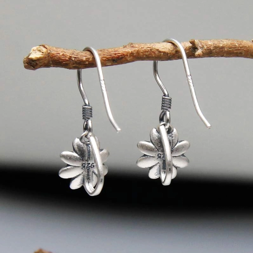 Sterling silver lotus earrings back view showing 925 hallmark stamp and layered lotus flower pendant construction