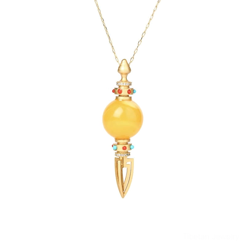 Front-facing view of complete 24K gold plated amber dorje vajra pendant necklace against pure white background