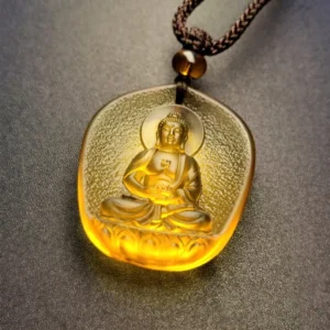 Dog or Pig Amitabha Buddha handcrafted Liuli crystal pendant necklace with woven cord, displaying intricate frosted carved details on dark background