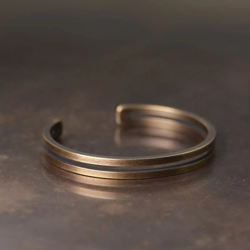 Brushed antique bronze Viking cuff bracelet front view showing smooth finish and open adjustable design