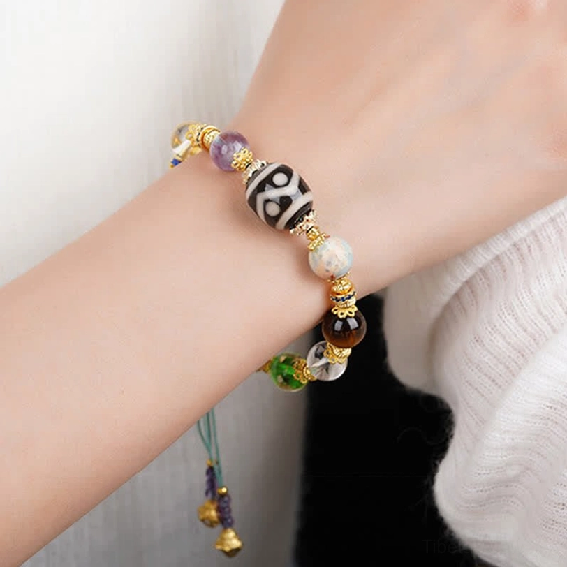 Dzi bracelet artisan craftsmanship showing hand-painted details and natural stones