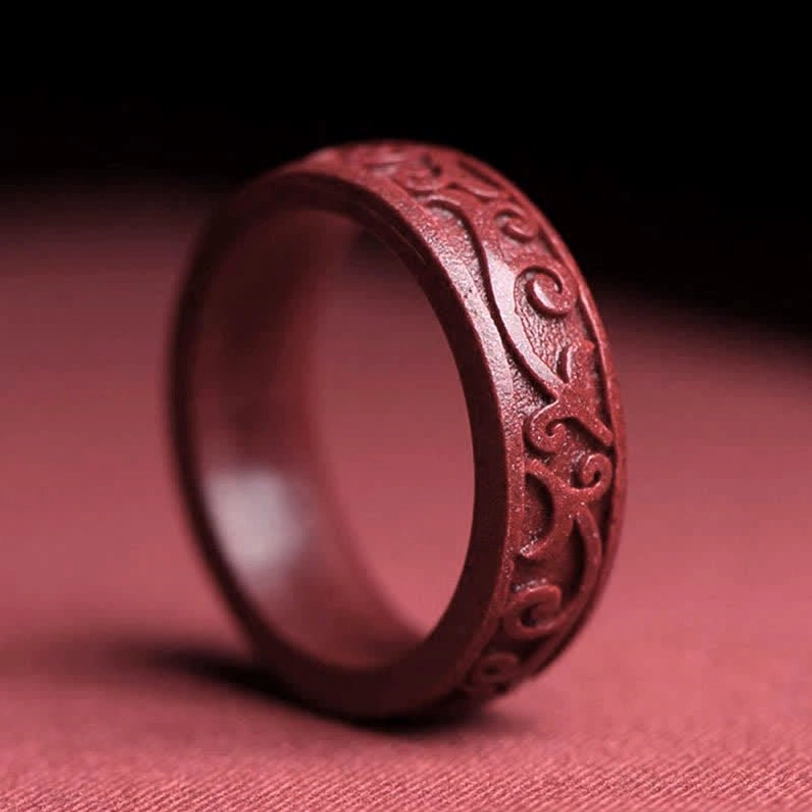 Auspicious clouds carved cinnabar blessing ring showcasing cloud motif design symbolizing good fortune and divine protection