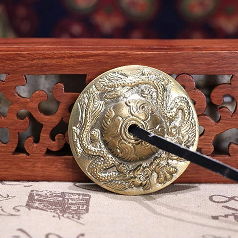 Authentic handcrafted tibetan tingsha cymbals with sacred symbols and protective dragon design