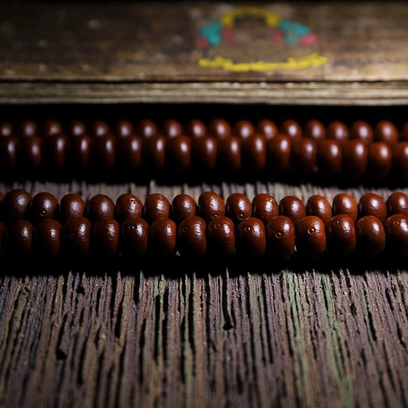 Handcrafted Tibetan mala beads showing natural color variations and authentic bodhi seed texture