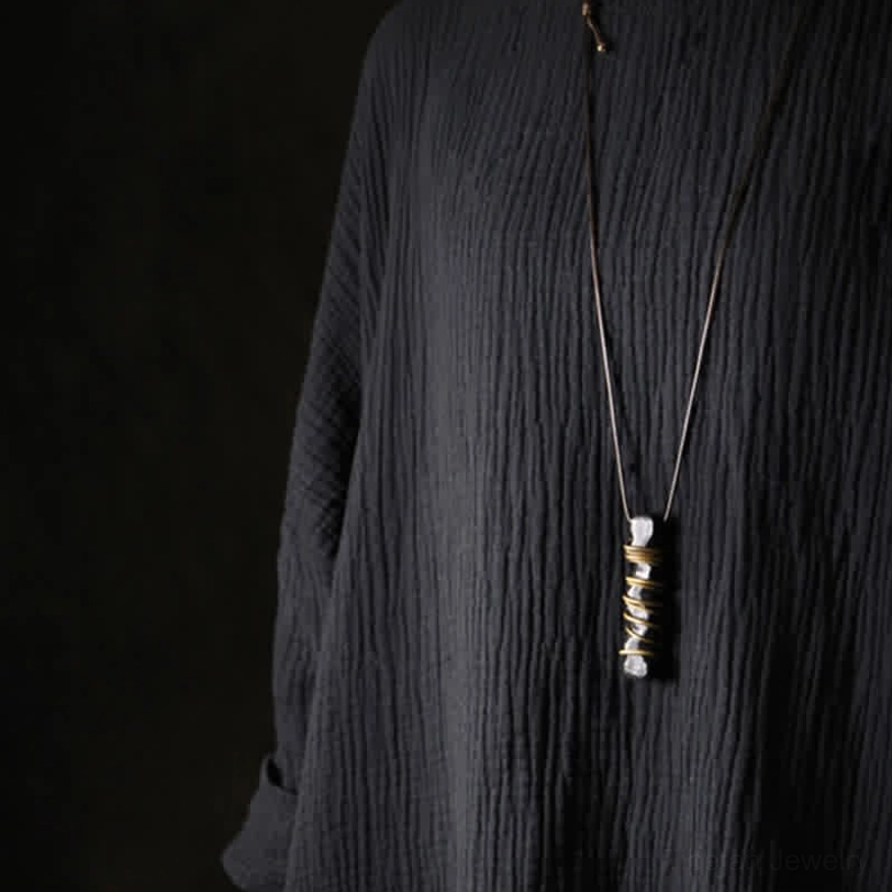 Handcrafted ebony wood Tibetan necklace detail showing natural wood variations and authentic brass hand-wrapping