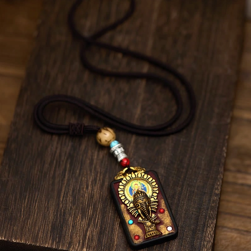Authentic Tibetan Ganesha ebony wood pendant with semi-precious stone setting