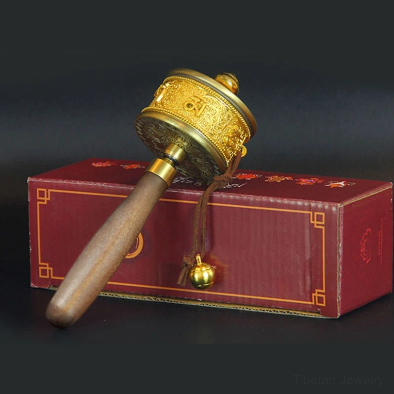 Tibetan prayer wheel spiritual meditation tool featuring authentic hand-engraved Six True Words mantra on premium copper with wooden handle