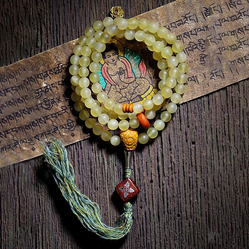 Authentic Tibetan sheep horn mala bracelet showing natural color variation and artisanal craftsmanship