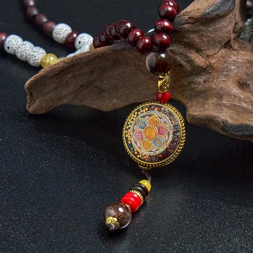 Authentic Tibetan handmade necklace featuring wood beads and protective copper charm