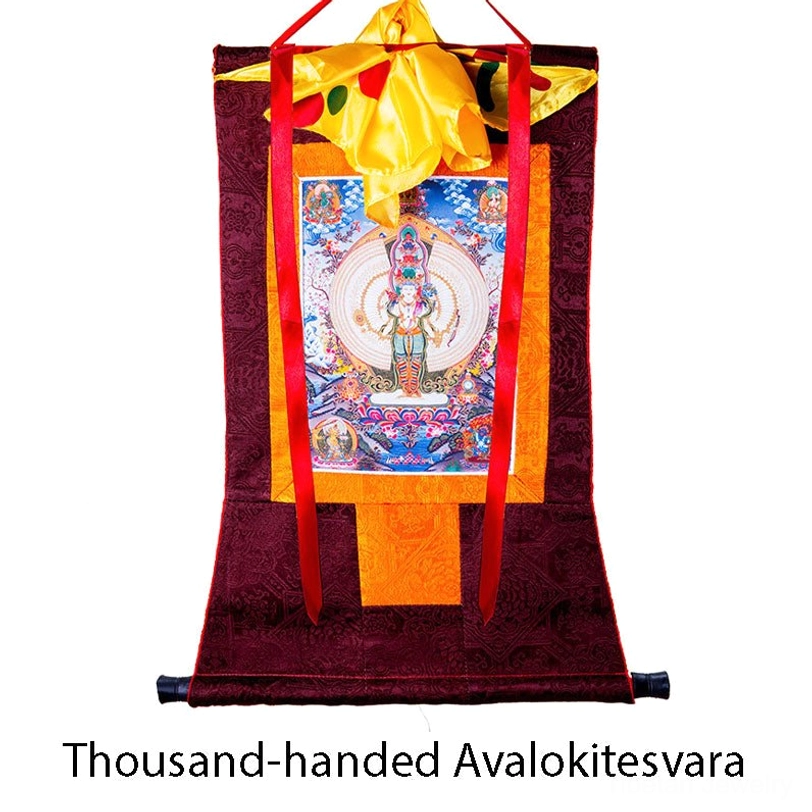Thousand-armed Avalokitesvara framed thangka meditation aid featuring colorful Buddhist deity painting with silk brocade border