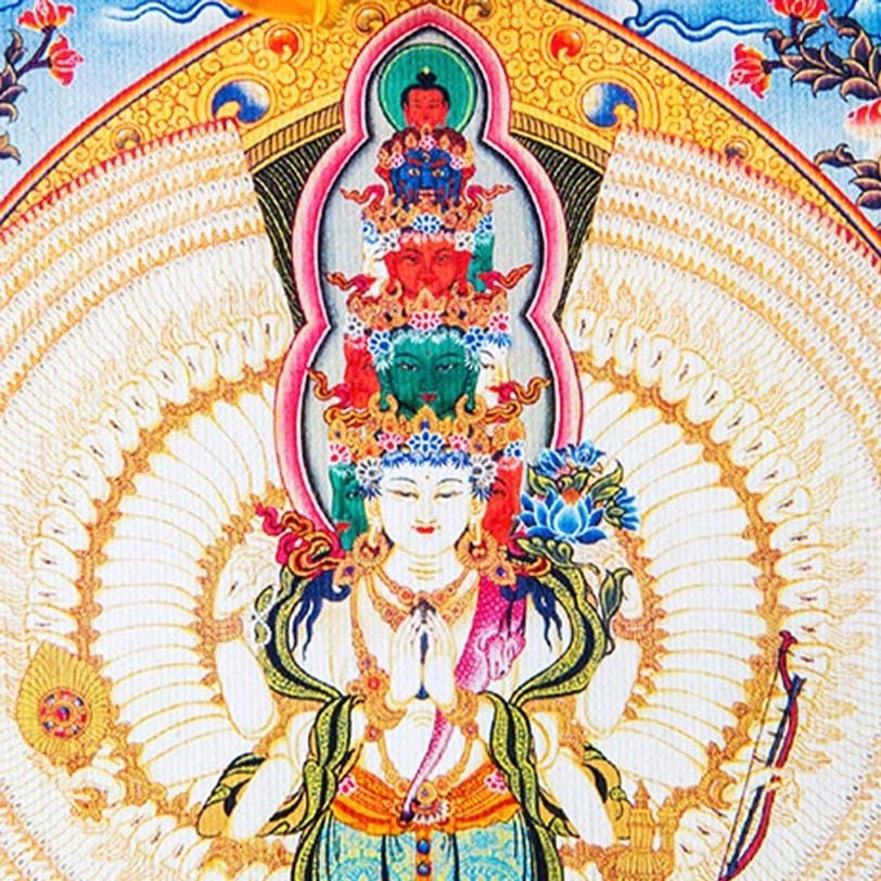 Tibetan Buddhist Avalokitesvara thangka sacred art representing universal compassion with traditional brocade frame and hanging ribbons