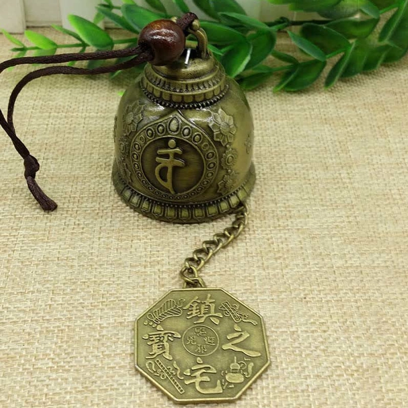 Big Family styled Tibetan wind chime bell with multi-figure embossed design and traditional bronze patina