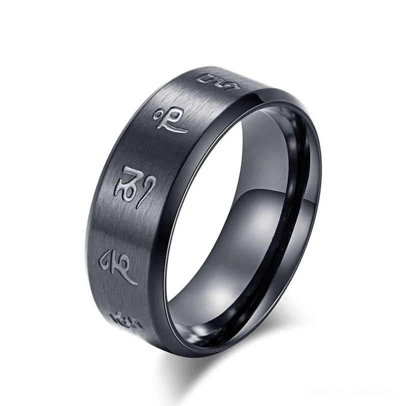 Black Jambhala Mantra titanium steel ring lifestyle wear-flat lay composition demonstrating versatile minimal aesthetic for daily spiritual practice