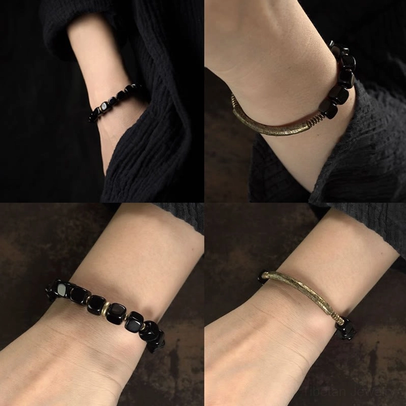 Black obsidian couple bracelet size comparison chart showing wrist circumference measurements in cm and inches for different sizes