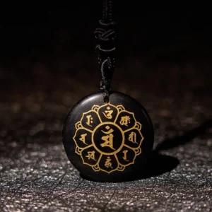Black Obsidian Om Mani Padme Hum mantra pendant necklace with golden Sanskrit engravings and black braided rope