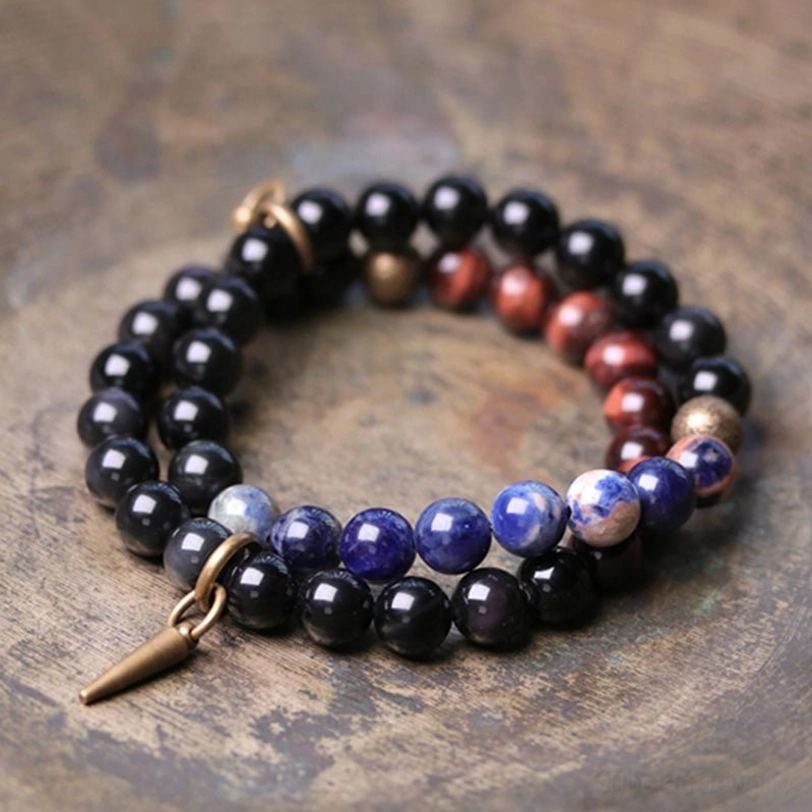 Black Obsidian and red stone couple bracelets with copper toggle clasp close-up detail shot - handmade healing crystal jewelry