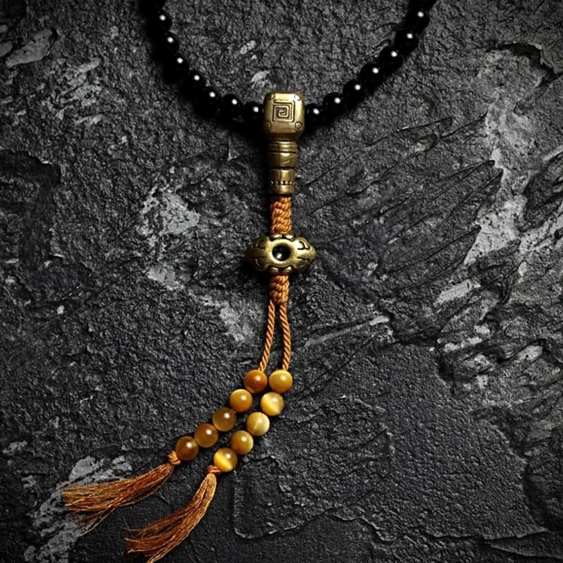 Black onyx and nine palaces bagua tibetan mala bracelet in 6mm and 8mm bead sizes showing protective amulet variations