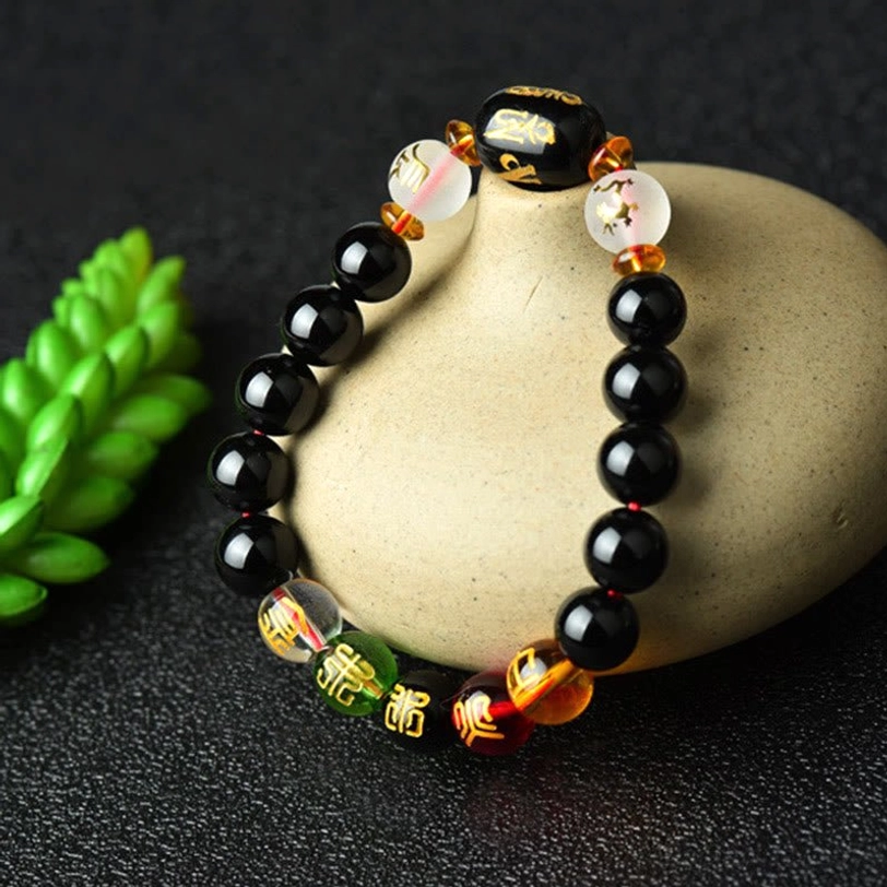 Black Onyx stone benefits guide showing protection, fortune, and support properties for spiritual practice and chakra activation