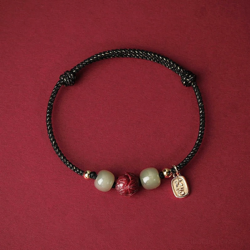Black silk rope Hetian jade and cinnabar lotus bracelet with protective sacred cord