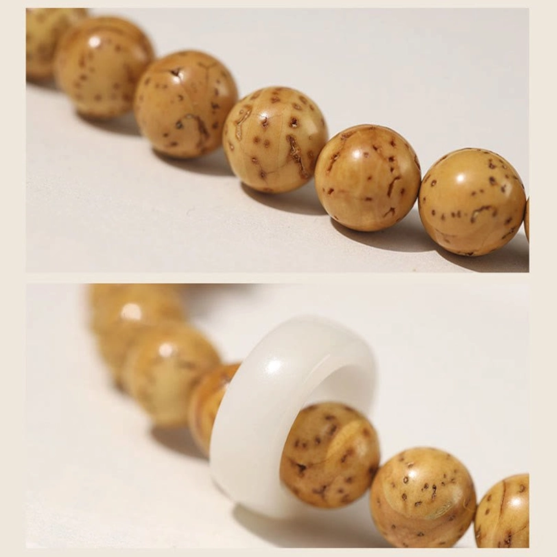 Double wrap Bodhi seed bracelet with copper turquoise spacer rings and metal charm detail shot