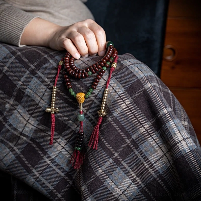 Hetian jade and purple bodhi seed mala beads showing natural color variations and patina