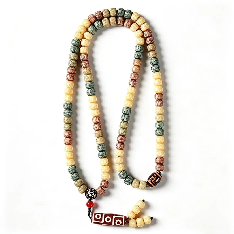 Bodhi seed 108 bead mala with swastika patterned dzi bead pendant on warm background overhead top-down view
