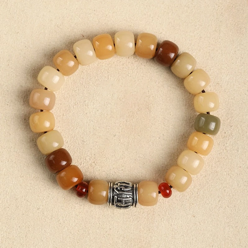 Bodhi seed Om Mani Padme Hum meditation bracelet, sacred mantra charm featuring earth tone natural beads and spiritual protection symbol