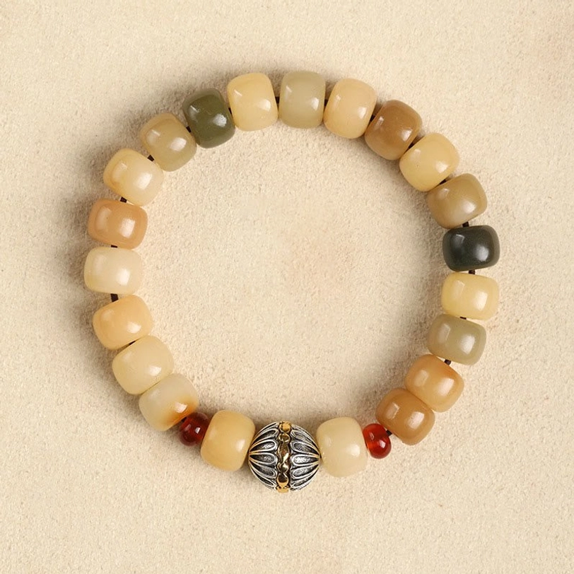 Bodhi seed cosmos flower Tibetan bracelet with natural beads, featuring earth tone gradient and decorative spiritual charm symbol