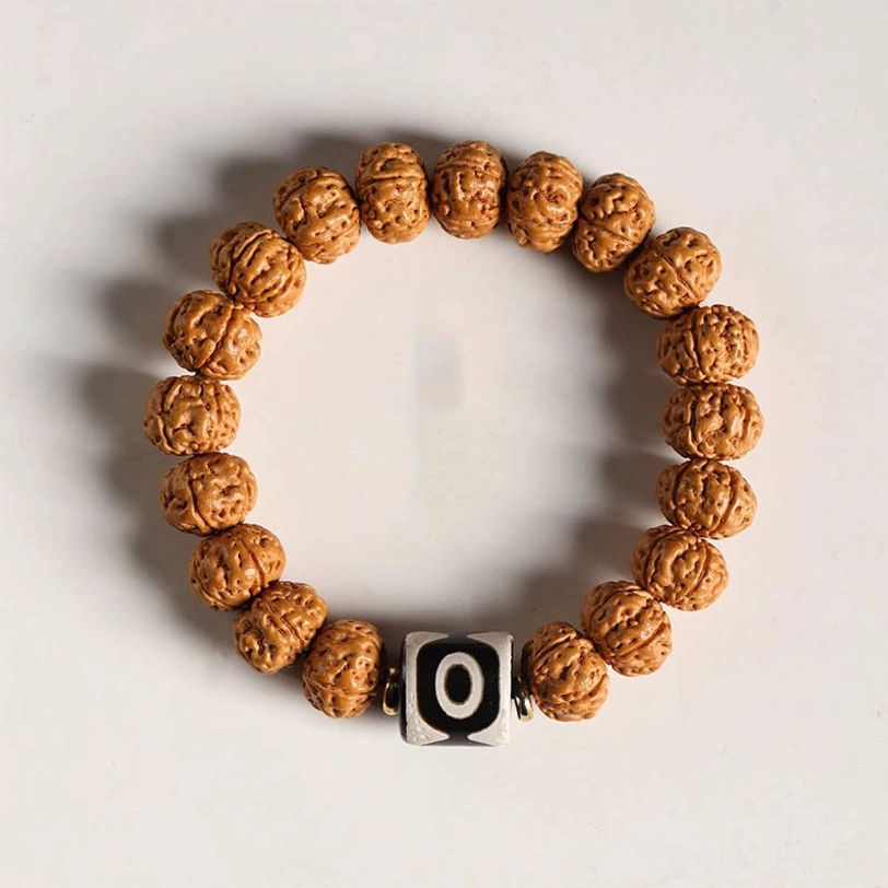 Bodhi seed bracelet with three-eye Dzi bead and red agate accent beads for meditation practice