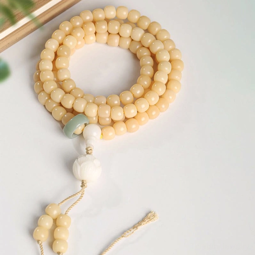 Bodhi seed lotus bracelet displayed on wrist showing comfortable elastic fit and natural beads