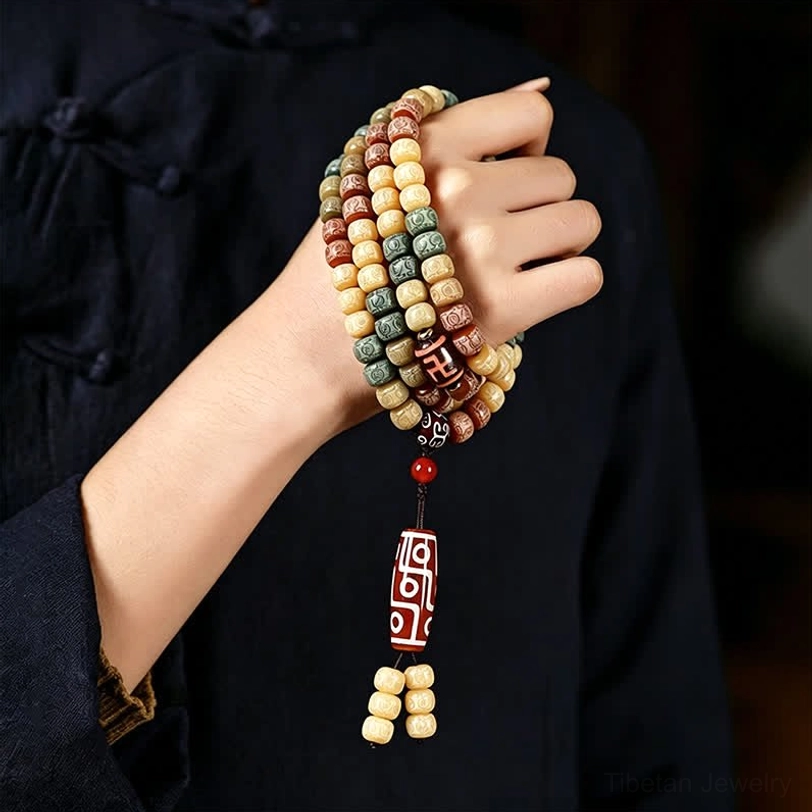 Authentic tibetan bodhi seed mala bracelet 108 beads with protective dzi bead pendant close-up detail view