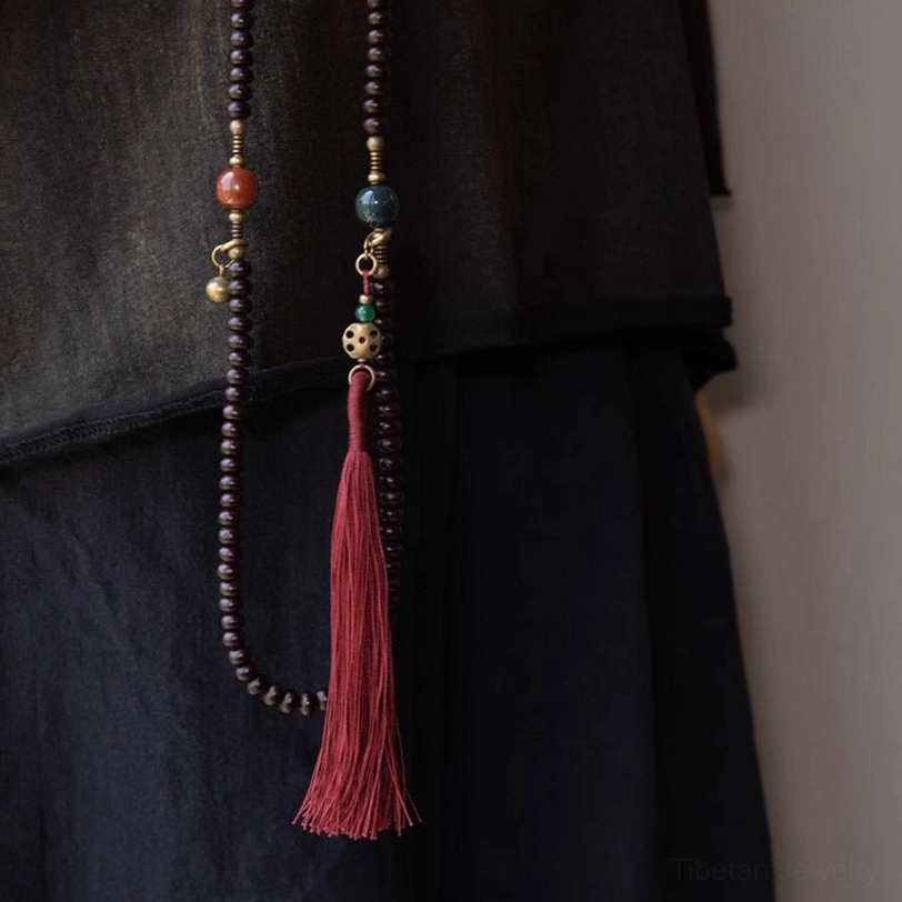 Purple bodhi seed mala prayer beads with traditional tassel for meditation practice