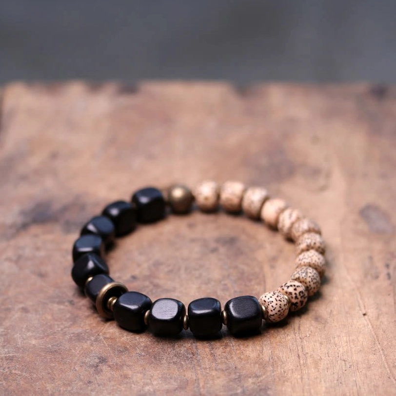 Two-tone Tibetan Bodhi Seed bracelet with cube black beads and round Bodhi seeds alternating design with brass spacers