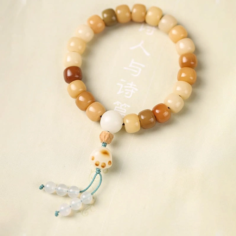 Bodhi seed wisdom bracelet collection, flat lay showing natural earth tone beads and various decorative spiritual charm styles