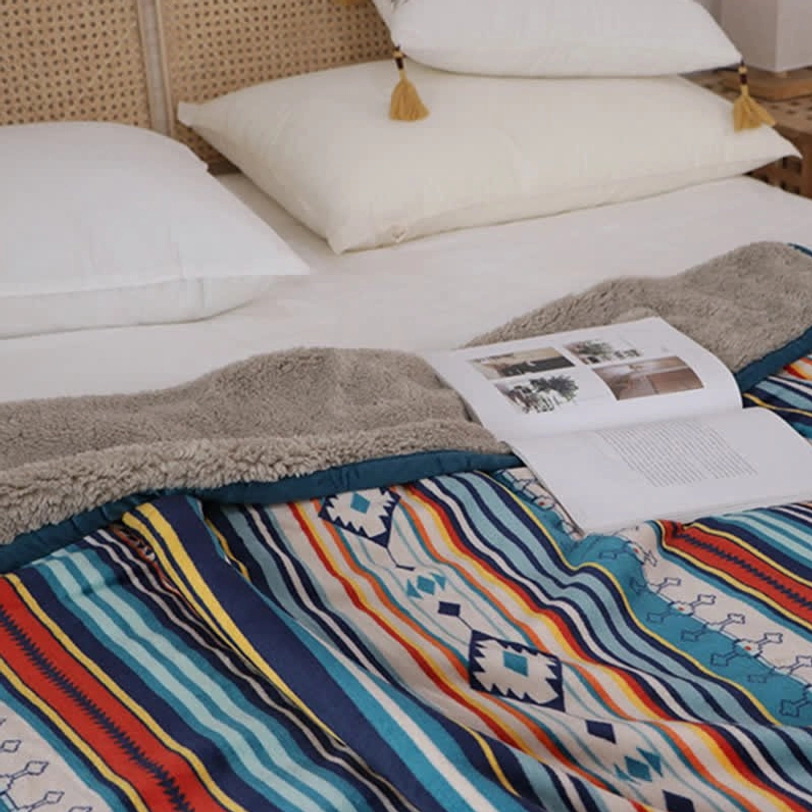 Bohemian throw blanket color palette showcase displaying vibrant earth tones, tribal print, and blue accent trim in natural lighting