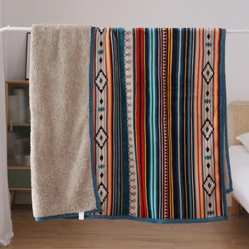 Bohemian throw blanket styled with yoga mat and meditation cushion, perfect for spiritual practice and wellness sanctuary setup
