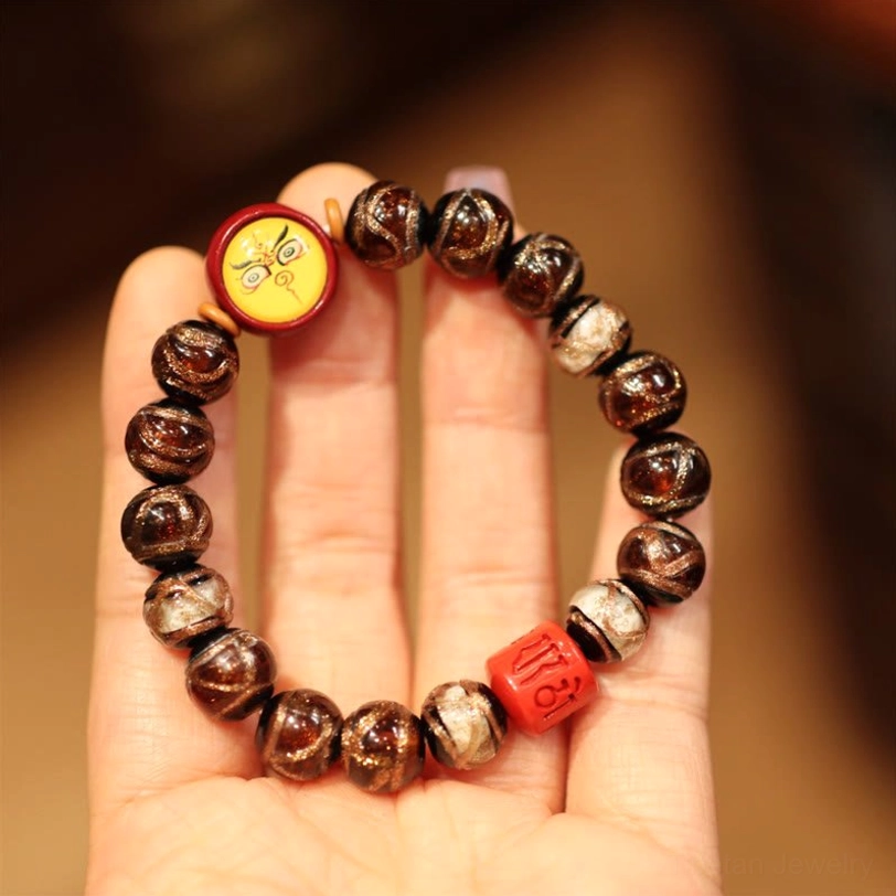 Brown White Yellow God of Wealth Tibetan bracelet featuring earth-tone beads and prosperity pendant