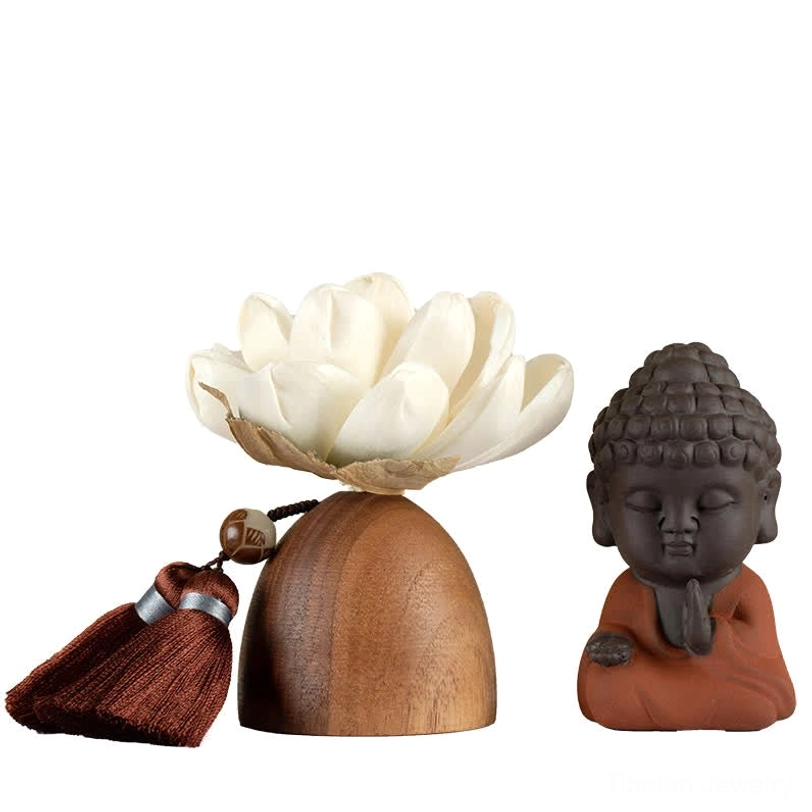 Unassembled Buddha lotus decoration components including wooden base, white lotus, and Buddha statue on white background
