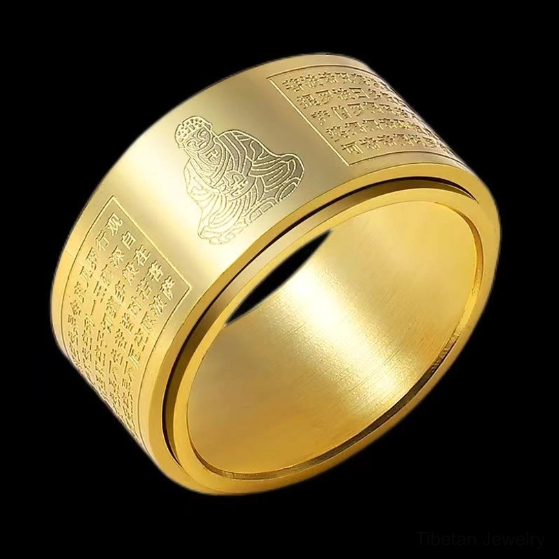 Rotating titanium steel Buddhist sutra ring showing inner spinner mechanism and sacred engravings