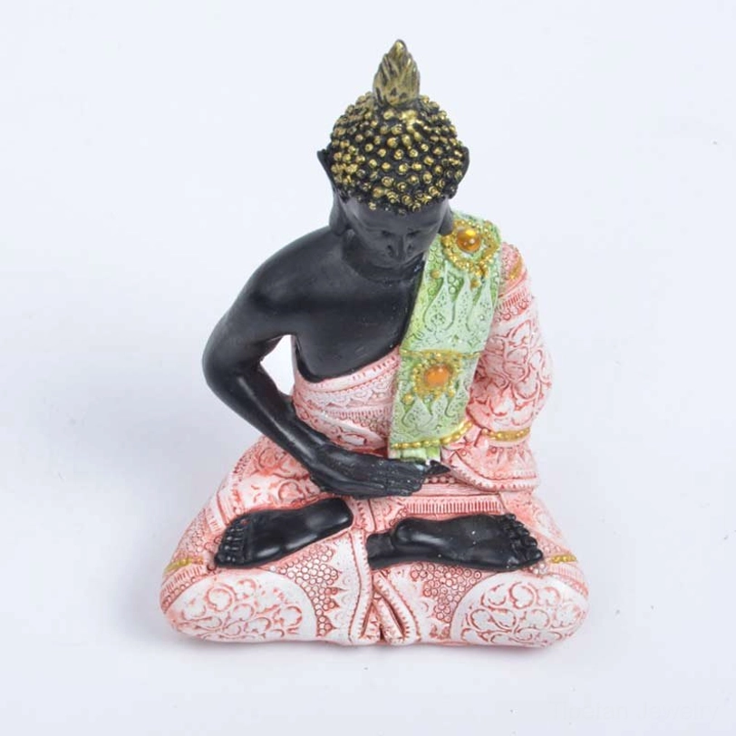 Handcrafted Buddha resin decoration showing earth-touching mudra gesture, pink green robe with gold trims, embossed traditional patterns, Tibetan feng shui home decor