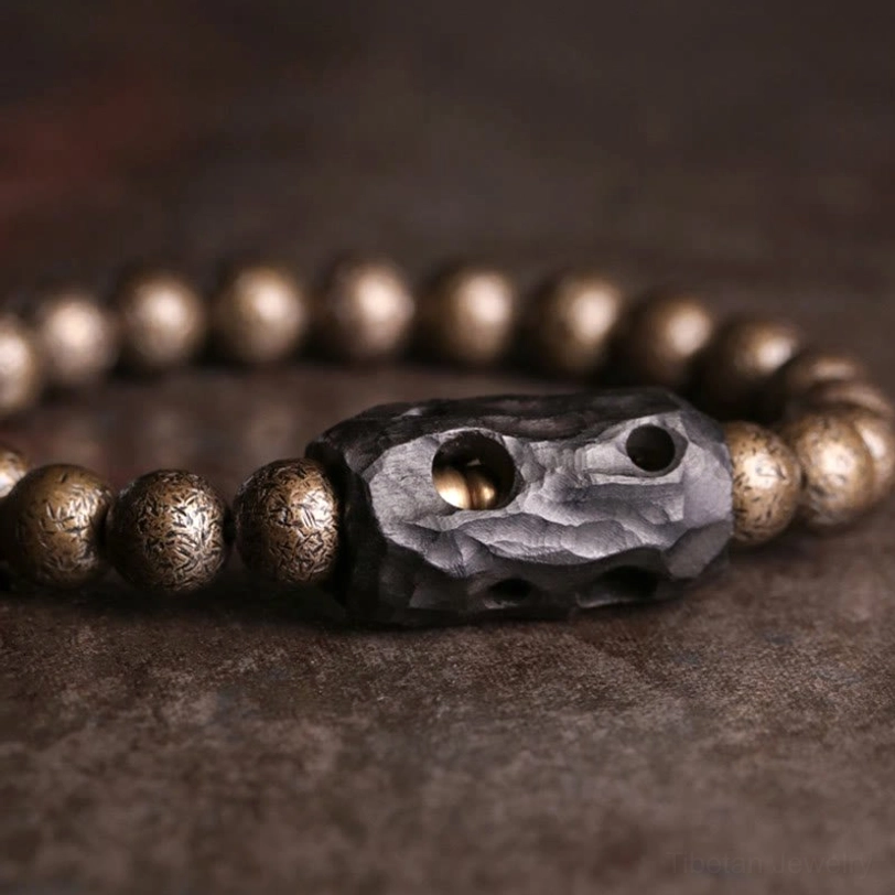 Ornate carved ebony wood spacer bead with multi-hole detail and polished copper bead accents