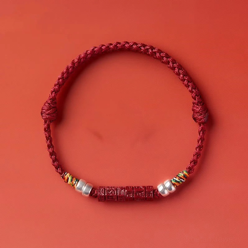 Cinnabar blessing bracelet with hand-tied knots and sterling silver charm pendant