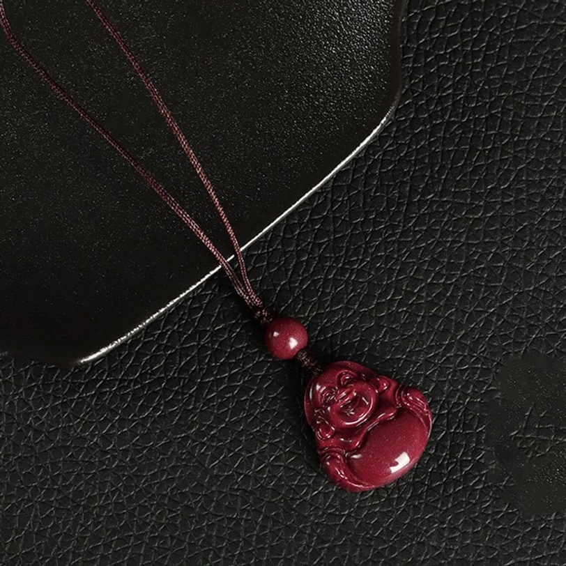 Three styles of cinnabar Buddha hanging accessories - necklace, phone lanyard, and keychain in unified wine red