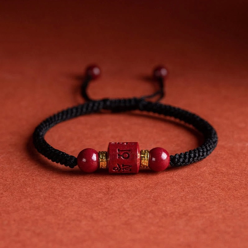 Black rope Tibetan Om Mani Padme Hum cinnabar blessing bracelet with engraved mantra bead and round cinnabar stones - adjustable wrist wear