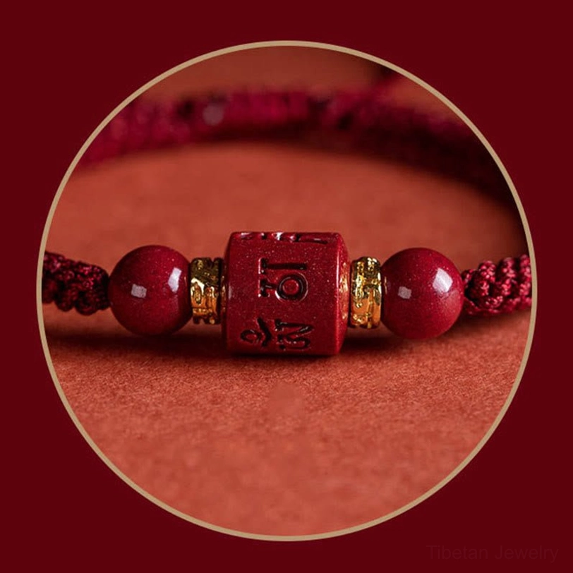Macro close-up of Tibetan cinnabar bracelet showing engraved Om Mani Padme Hum bead, round cinnabar stones, gold spacers, and woven cord - circular frame detail