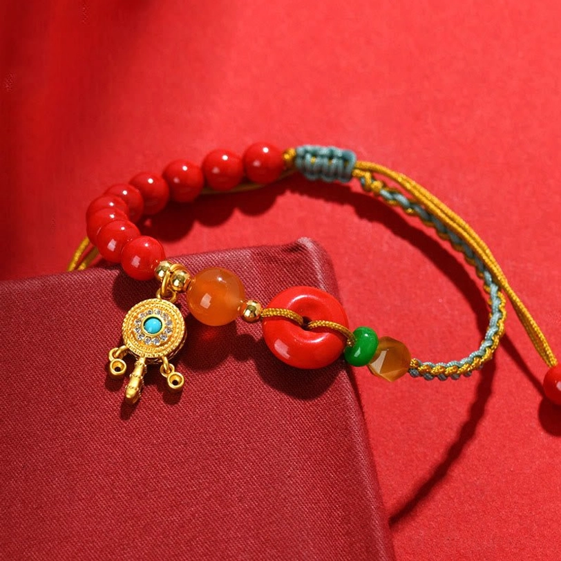Tibetan cinnabar peace buckle bracelet with gold-plated copper accents and adjustable braided string fit